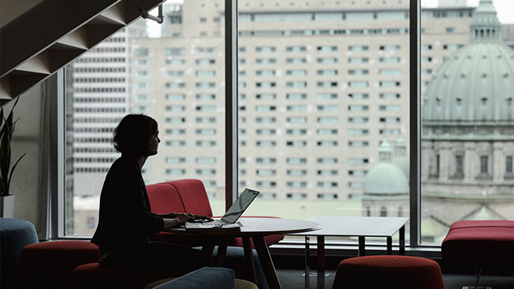 Photo of employee pondering in a peaceful environment